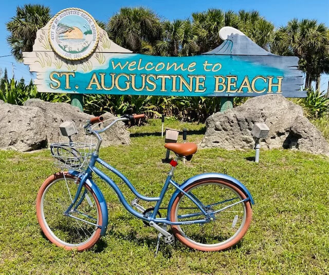 Anastasia Bicycle Rental cruiser at the St. Augustine Beach sign
